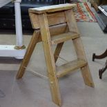 A small 3-step folding pine ladder