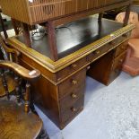 A Victorian mahogany twin-pedestal writing desk