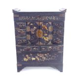 A Japanese gilded black lacquer kodansu table-top cabinet, Meiji Period, with hinged lid, brass-