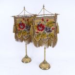 A pair of 19th century Berlin beadwork face screens, mounted on original gilt-brass stands on relief