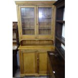 An Antique Continental 2-section pine dresser, W107cm, H210cm