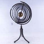 A Vintage modernist celestial wrought-iron and brass armillary sphere, on folding tripod base,