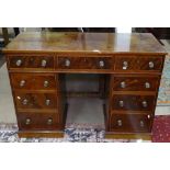 An Edwardian mahogany twin-pedestal writing desk, with 9 short fitted drawers, W122cm, H84cm