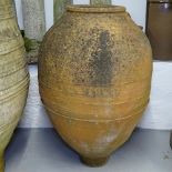 A weathered terracotta Cretan design oil jar, H90cm