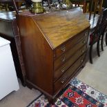 A George II mahogany bureau, fall-front revealing a drawer and pigeon hole fitted interior, 4 long