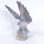 A large Spanish Miguel Requena porcelain eagle on rocky outcrop, sculptor formerly of Lladro, height