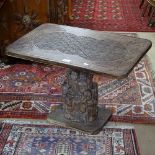An African carved hardwood side table with figural column, W70cm, H48cm
