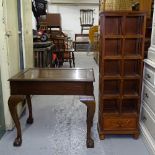 A rectangular oak lamp table, on cabriole legs, and a narrow stained wood open bookcase