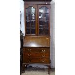 An Edwardian mahogany and ebony-strung bureau bookcase, W84cm