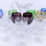 A set of 7 harlequin hock glasses, 5 Tudor claret glasses, and a heavy cut-glass jug