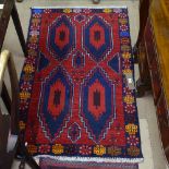 A red ground Beluchi rug
