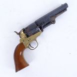 An Italian replica Colt percussion revolver, 5" octagonal blued barrel with brass frame and hardwood