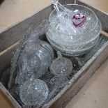 A weathered pine crate containing various moulded glass bowls, jars etc