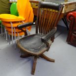 A late 19th century slat-back swivel desk chair