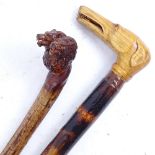 2 polished branch wood trekking sticks, with dog and wolf knops (2)
