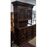 An Antique Continental oak 2-section buffet, with coloured leadlight glazed cupboard doors, and