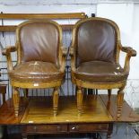 A pair of oak-framed and studded upholstered open armchairs