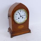 A French mahogany lancet-top 8-day mantel clock, satinwood inlay with brass mounts and white