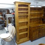 A modern polished pine open bookcase, with adjustable shelves, W76cm, H200cm