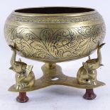 An Indian brass incense burner/potpourri, on tri-form elephant stand, bowl diameter 21cm
