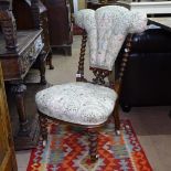 A Victorian upholstered nursing chair, with Prince of Wales design back on barley twist legs