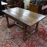 An Antique rectangular oak plank-top dining table, on carved base with turned legs and H-shaped