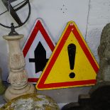 A pair of road warning signs