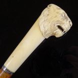 A 19th century walking cane with carved ivory leopard's head handle