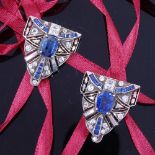 A pair of Art Deco unmarked silver sapphire and paste dress clips, geometric opposing form set