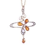 An Art Nouveau 9ct gold citrine and split pearl pendant necklace, scrolled clover form, on 9ct