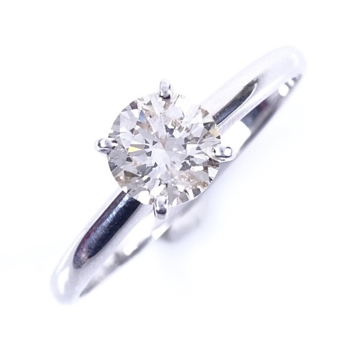 A modern 14ct white gold 1.01ct solitaire diamond ring, in high 4-claw setting, colour approx M/N,
