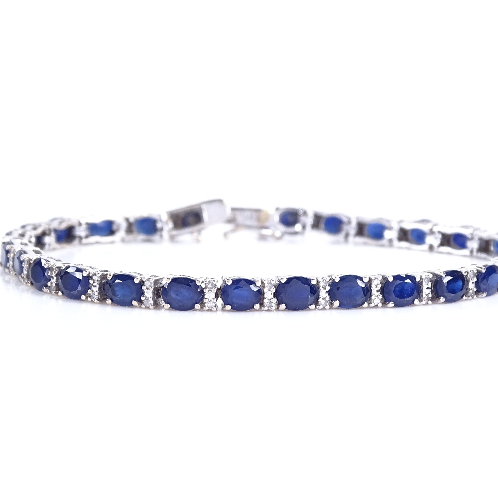 A modern 18ct white gold sapphire and diamond tennis line bracelet, total diamond content approx 0.