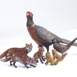 A large cold painted bronze pheasant, length 19cm, together with a group of smaller cold painted