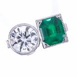 A 2-stone emerald and diamond ring, set with an octagonal emerald within a square surround and a