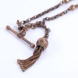 A 9ct gold fancy link Albert chain, with T-bar, dog clip and tassel, overall length 27cm, 9.3g