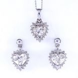 A heart shaped diamond cluster pendant necklace and stud earring demi-parure, set with central heart