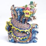 A Chinese glazed ceramic dragon design candle stand, impressed marks under base, height 14cm The