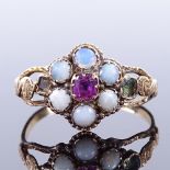 A 19th century unmarked gold ruby cabochon opal gem set cluster memorial ring, glass covered hair