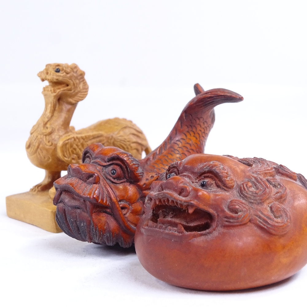 3 Japanese carved wood dragon design netsuke, including a dragon fish, length 6.5cm (3)