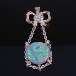 A handmade unmarked gold cabochon black opal and diamond cluster pendant, 5.9ct opal suspended