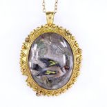 A Victorian unmarked gold Essex Crystal pendant/brooch, reverse painted as a goldfinch on a