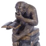 After Bonheur, a patinated bronze sculpture, monkey reading, height 26cm