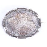 An Antique unmarked silver brooch, depicting lady in landscape, brooch length 67.7mm, 26.6g Good