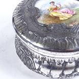 A French nickel plate circular box, with inset porcelain plaque to the lid, diameter 12cm