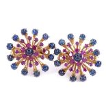 A pair of French 18ct gold cabochon sapphire and ruby cluster clip earrings, flowerhead design