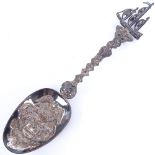 An early 20th century Dutch silver spoon, with ship finial and relief embossed bowl, import marks of