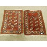 A pair of handmade Persian red ground rugs, 95cm x 70cm.