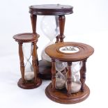 3 wood-framed hour glasses, largest height 24cm, modern One china panel cracked on 3 glass timer,