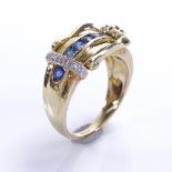 A modern 9ct gold sapphire and diamond buckle ring, setting height 11.7mm, size O, 4.1g Good overall