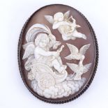 A 19th century relief carved shell cameo panel brooch, depicting cherubs and doves, in unmarked